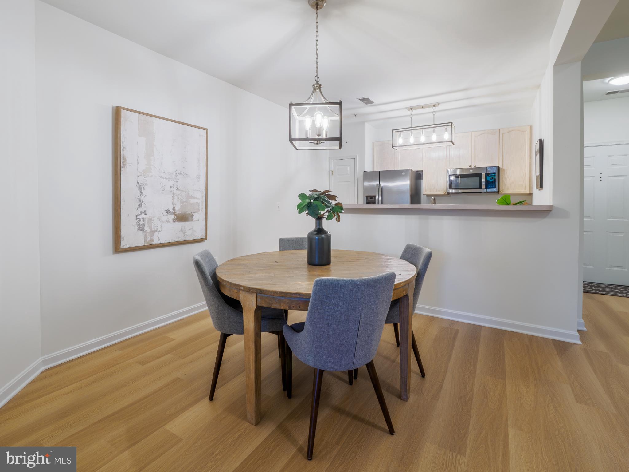 4330 L Cannon Ridge Court, Unit 31 Fairfax, VA 22033 - Photo 6 of 28 Dining area with new chandelier