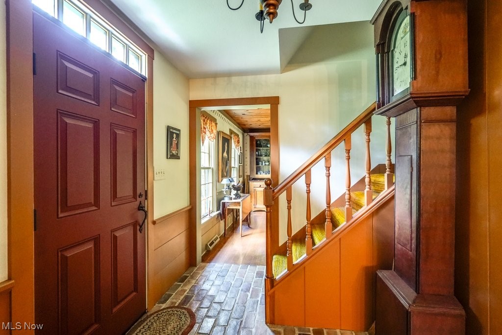 9699 Acme Road Rittman, OH 44270 - Photo 7 of 36 Entryway featuring a wealth of natural light and hardwood / wood-style floors