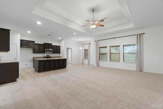 a large room with kitchen view