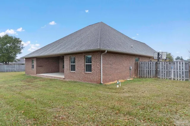 a backyard of a house with lots of green space