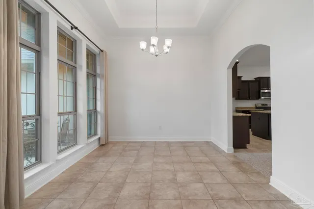a view of a kitchen with a sink and a kitchen counter top space