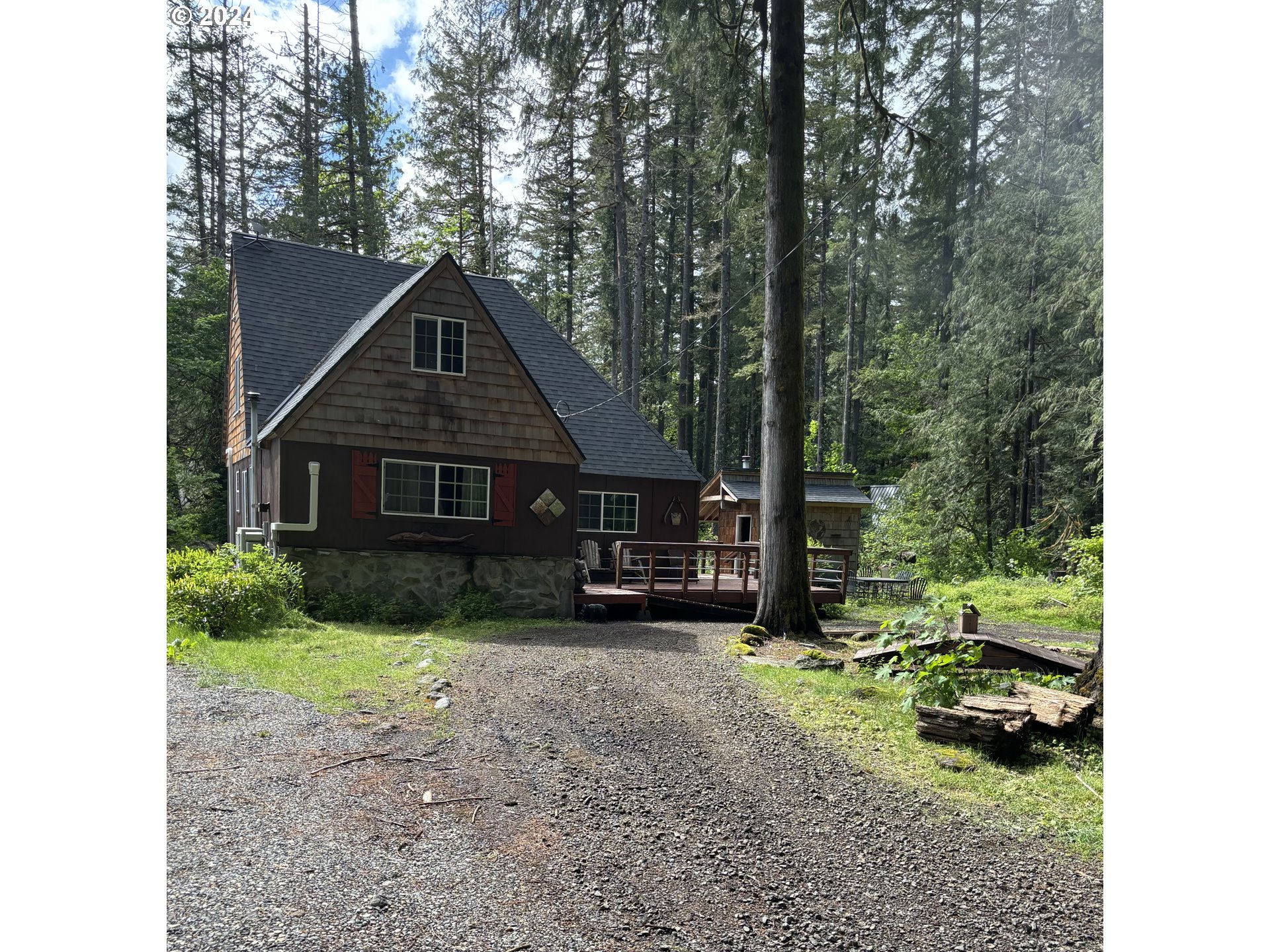 26855 East Chinook Lane Rhododendron, OR 97049 - Photo 1 of 15 a view of a house with a yard