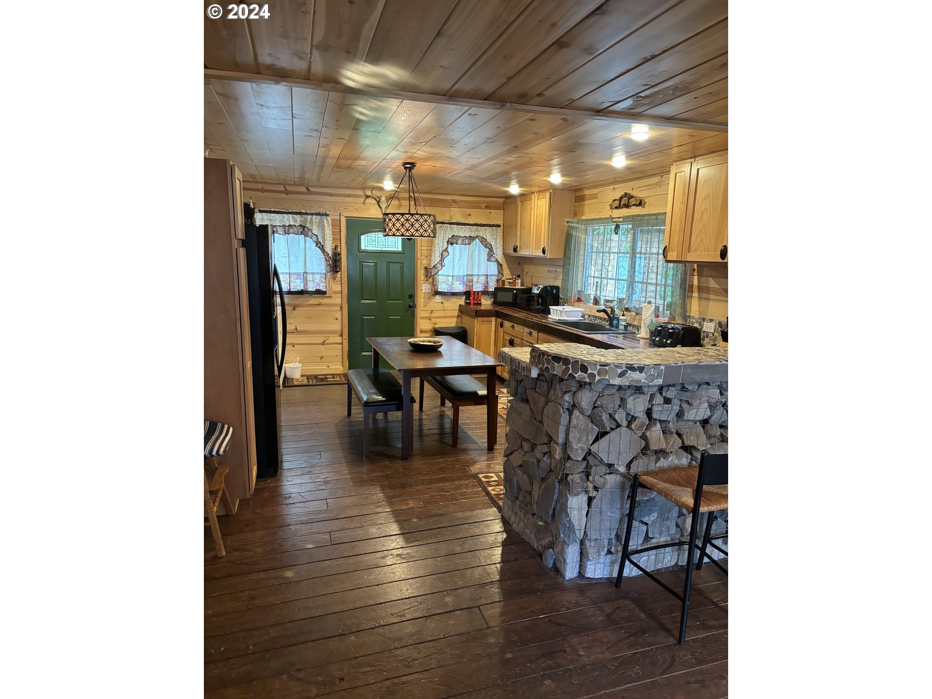 26855 East Chinook Lane Rhododendron, OR 97049 - Photo 5 of 15 a dining room with furniture and wooden floor
