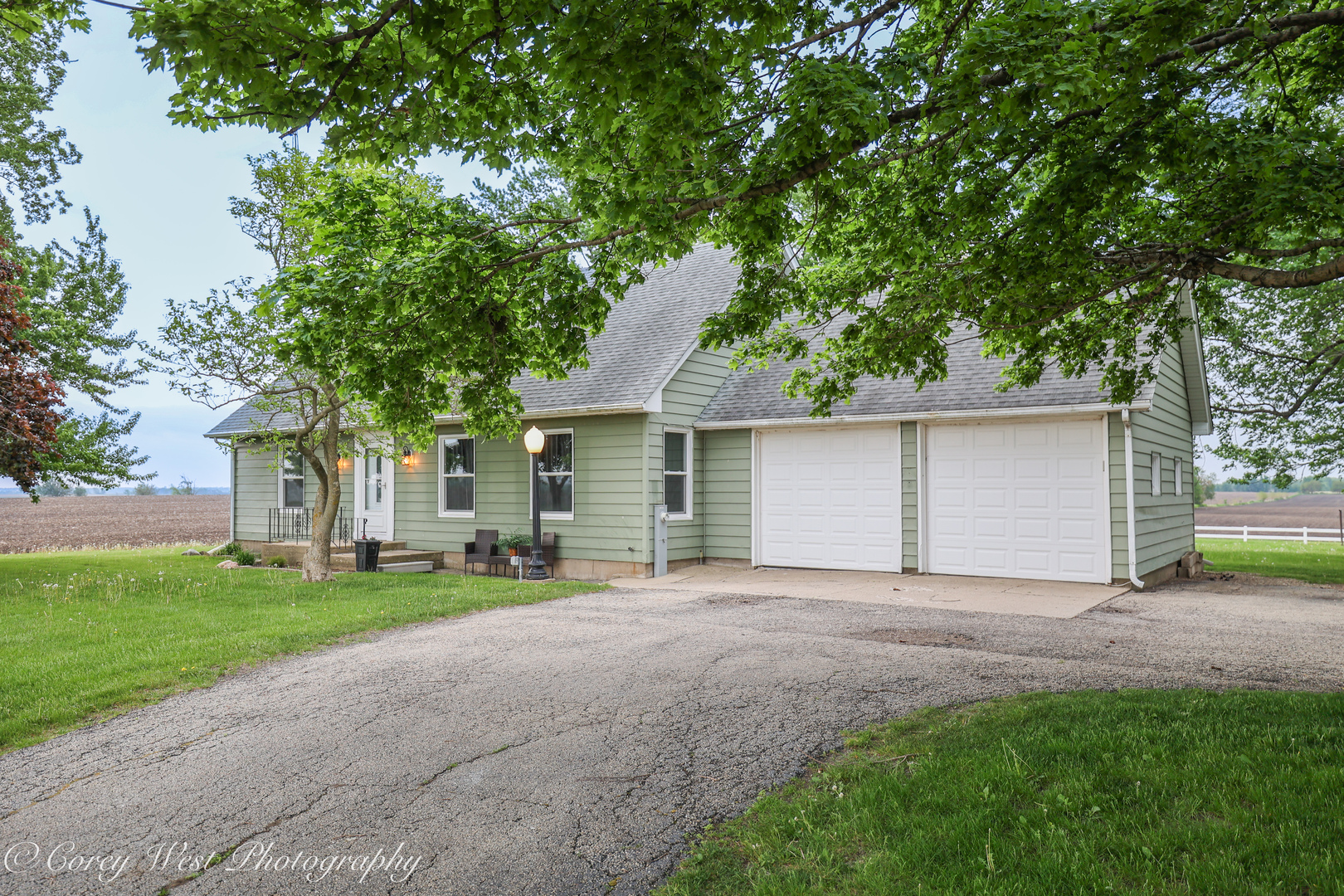 8994 Highway 64 Sycamore, IL 60178 - Photo 3 of 37 a view of a house with a yard and large tree