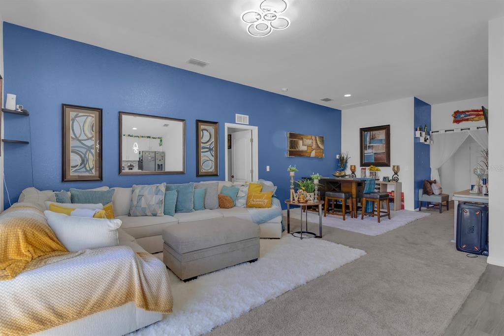 205 Arbuthnot Street Winter Haven, FL 33881 - Photo 13 of 31 a living room with furniture and a table