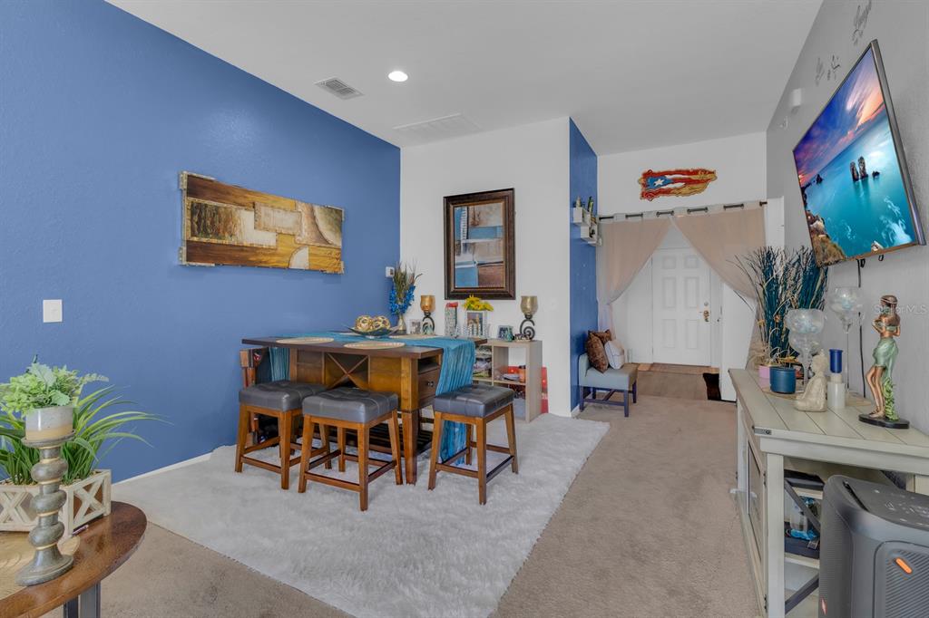 205 Arbuthnot Street Winter Haven, FL 33881 - Photo 14 of 31 a living room with furniture and wooden floor