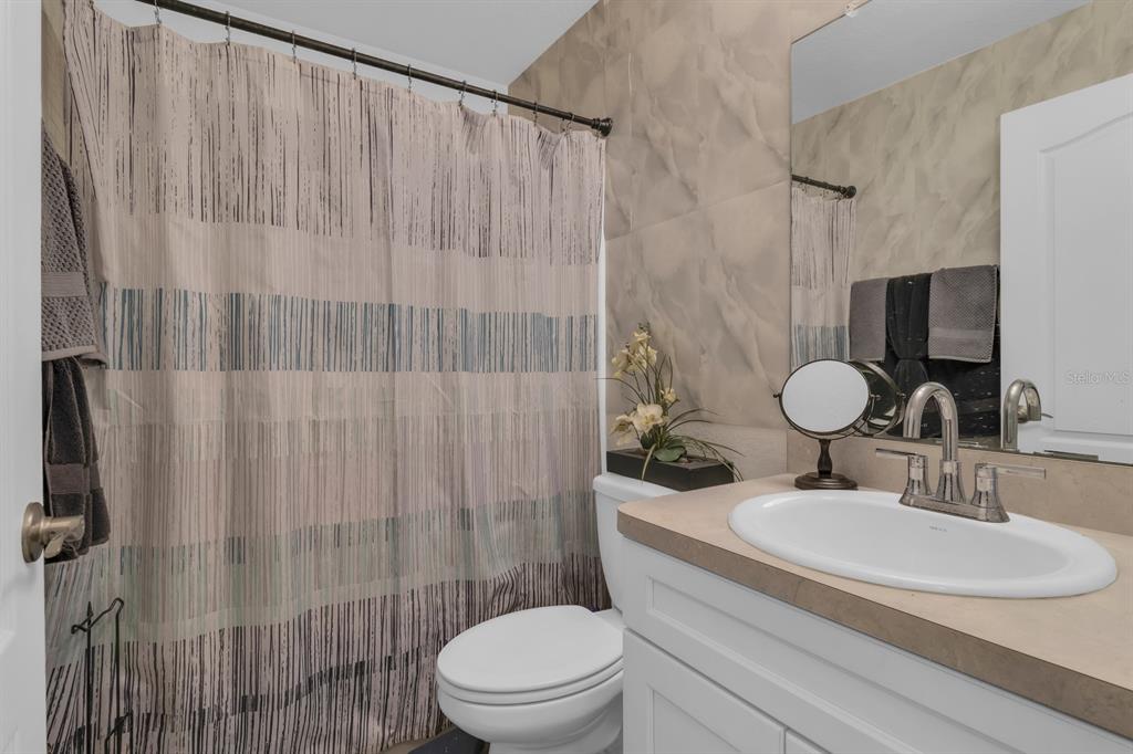 205 Arbuthnot Street Winter Haven, FL 33881 - Photo 23 of 31 a bathroom with a sink toilet and shower
