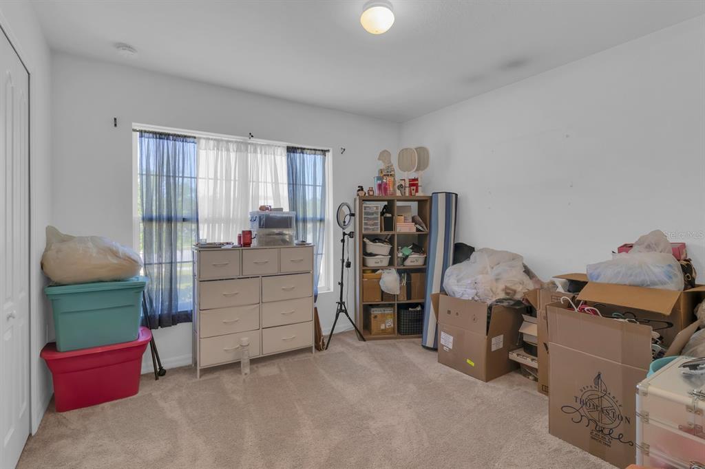 205 Arbuthnot Street Winter Haven, FL 33881 - Photo 25 of 31 a bedroom with a bed and a window