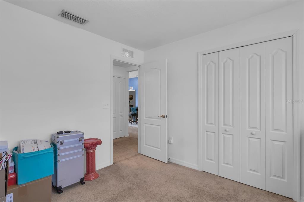 205 Arbuthnot Street Winter Haven, FL 33881 - Photo 26 of 31 a living room with furniture and a gate
