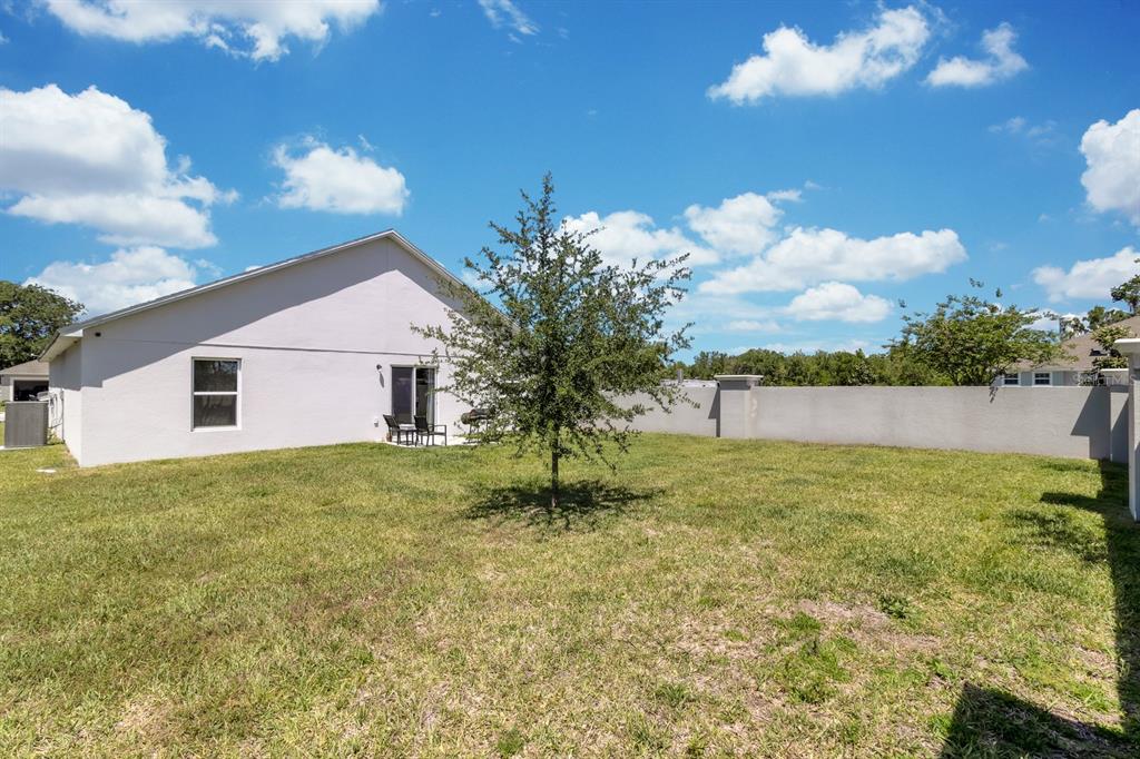 205 Arbuthnot Street Winter Haven, FL 33881 - Photo 28 of 31 a house view with swimming pool and green space