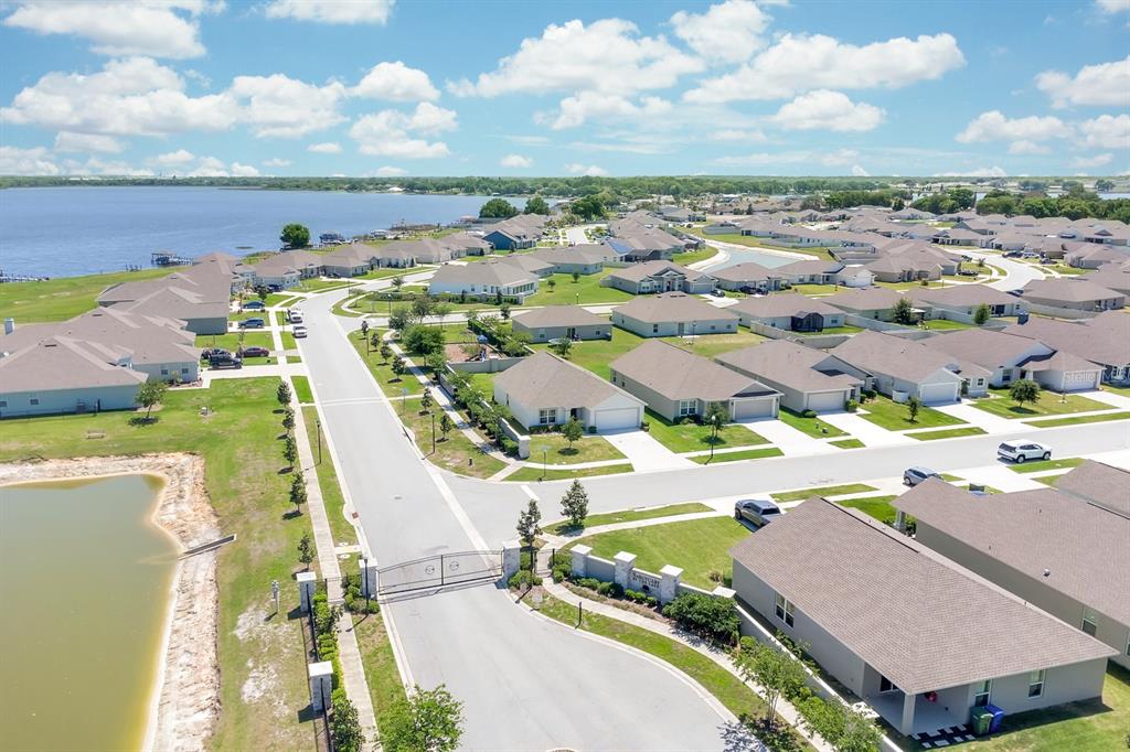 205 Arbuthnot Street Winter Haven, FL 33881 - Photo 30 of 31 an aerial view of a house with a swimming pool yard and mountain view in back