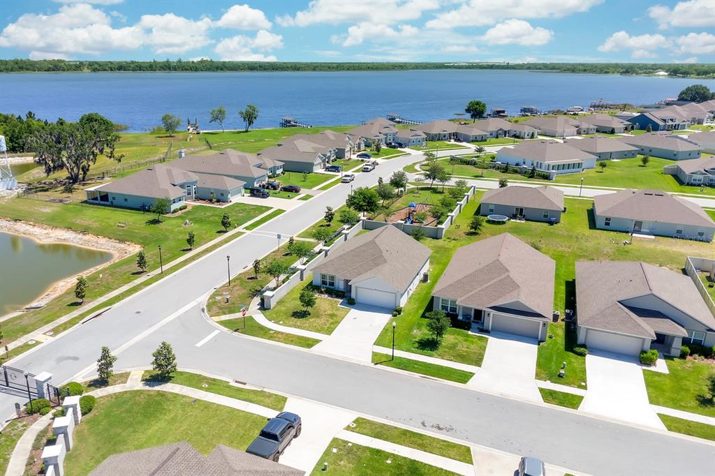 205 Arbuthnot Street Winter Haven, FL 33881 - Photo 31 of 31 an aerial view of a house with a garden and lake view