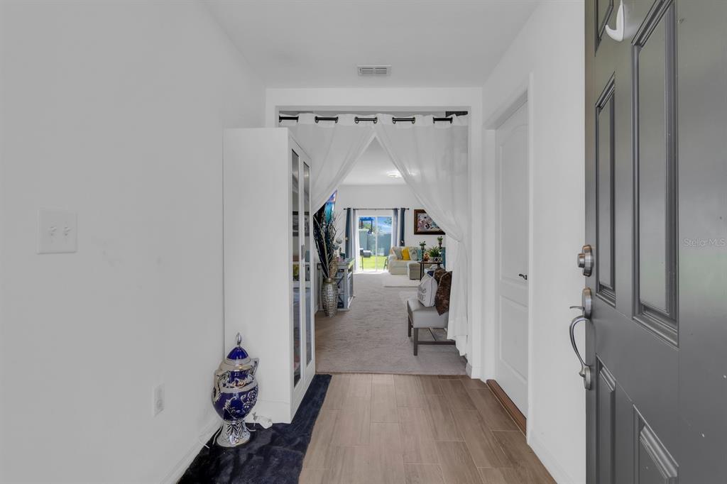 205 Arbuthnot Street Winter Haven, FL 33881 - Photo 6 of 31 a view of entryway with livingroom