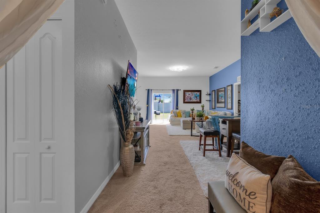 205 Arbuthnot Street Winter Haven, FL 33881 - Photo 8 of 31 a living room with furniture and a potted plant