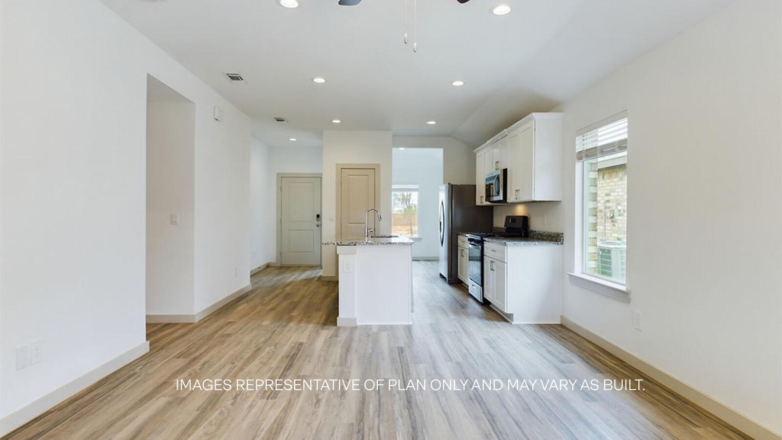 7419 9th Street Lubbock, TX 79416 - Photo 8 of 21 a view of a kitchen with a sink and a refrigerator