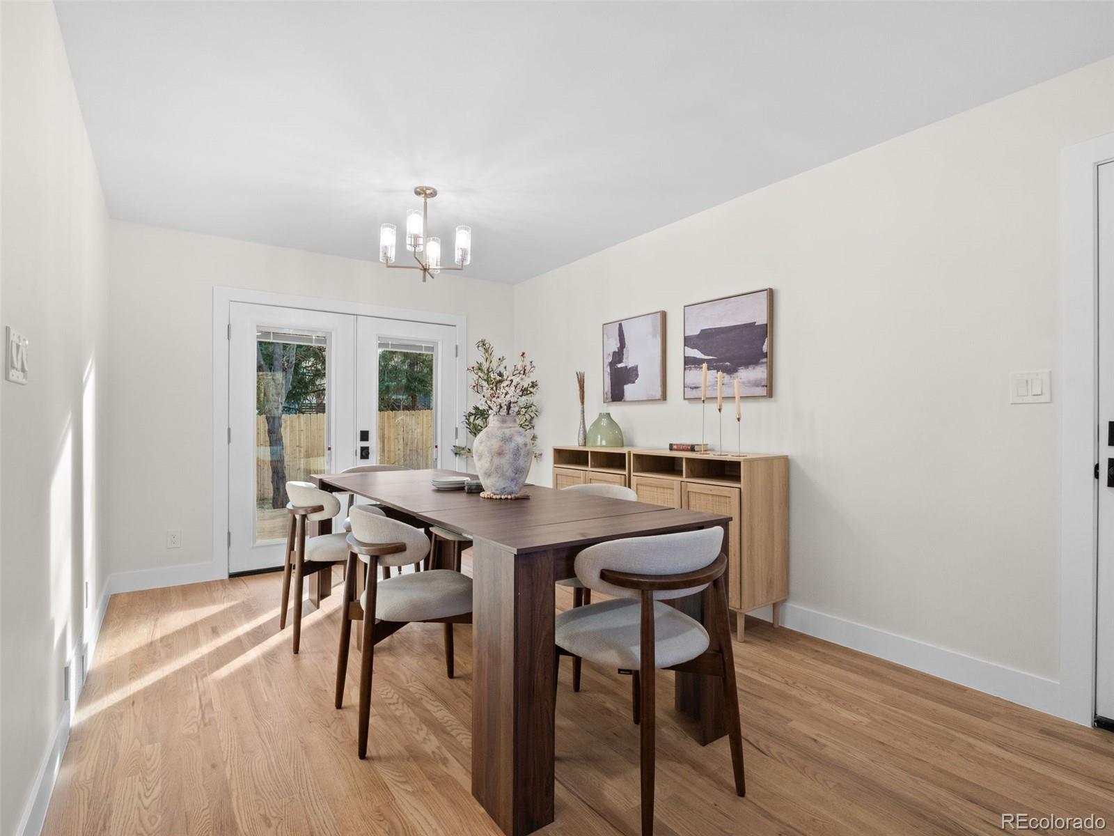 3490 Emerson Avenue Boulder, CO 80305 - Photo 11 of 31 a view of a dining room with furniture and wooden floor