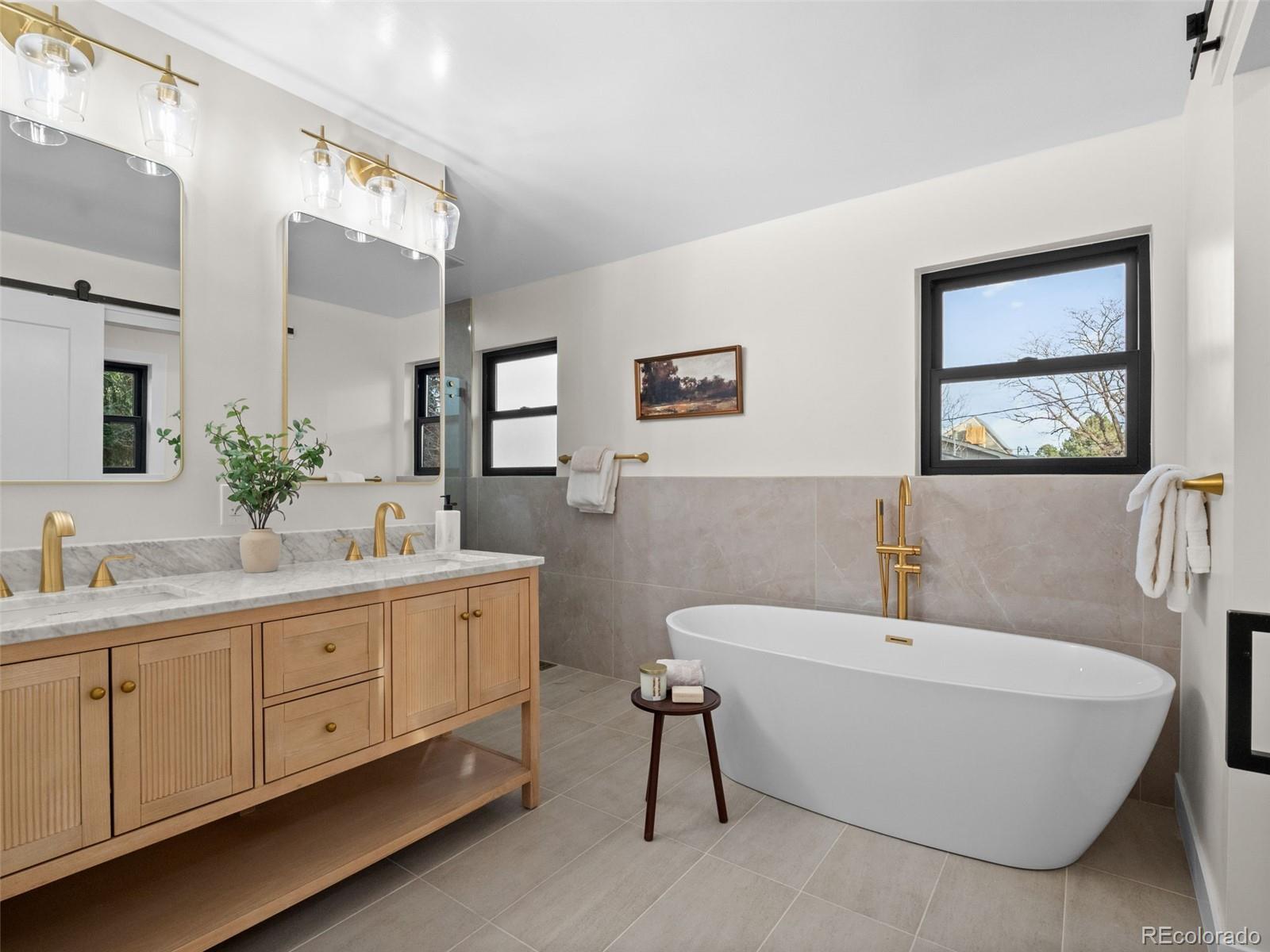 3490 Emerson Avenue Boulder, CO 80305 - Photo 13 of 31 a bathroom with a double vanity sink mirror and bathtub