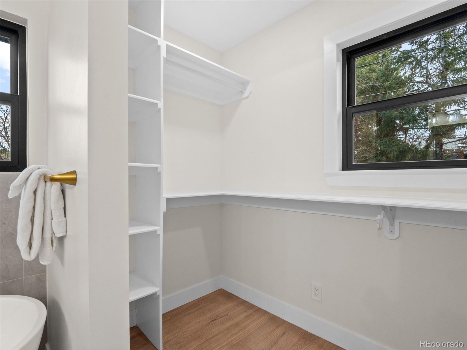 3490 Emerson Avenue Boulder, CO 80305 - Photo 15 of 31 a bathroom with a shower and a window