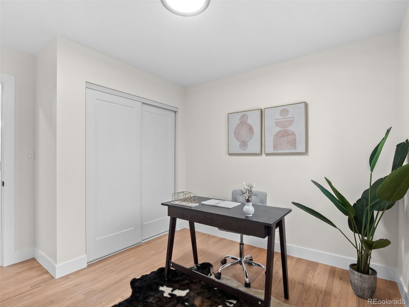 3490 Emerson Avenue Boulder, CO 80305 - Photo 16 of 31 a workspace with furniture and wooden floor