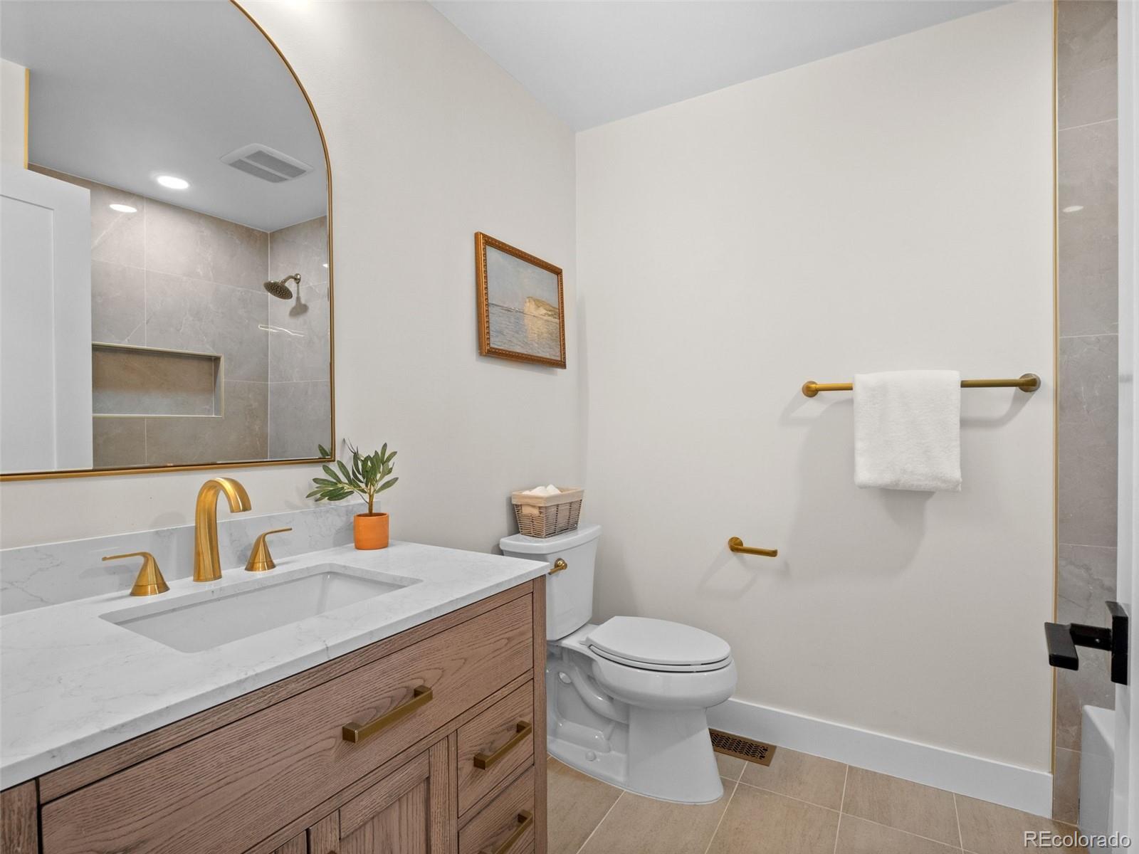 3490 Emerson Avenue Boulder, CO 80305 - Photo 18 of 31 a bathroom with a toilet sink and mirror