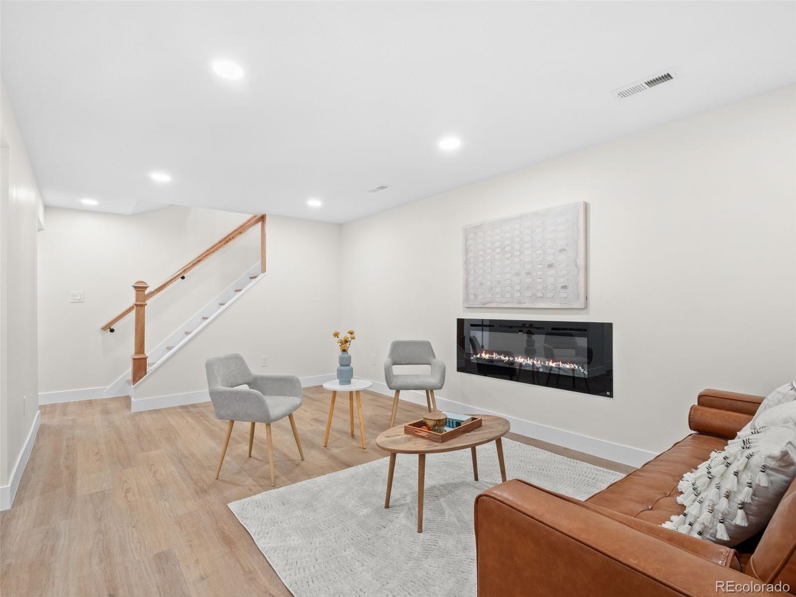 3490 Emerson Avenue Boulder, CO 80305 - Photo 22 of 31 a living room with furniture and a fireplace