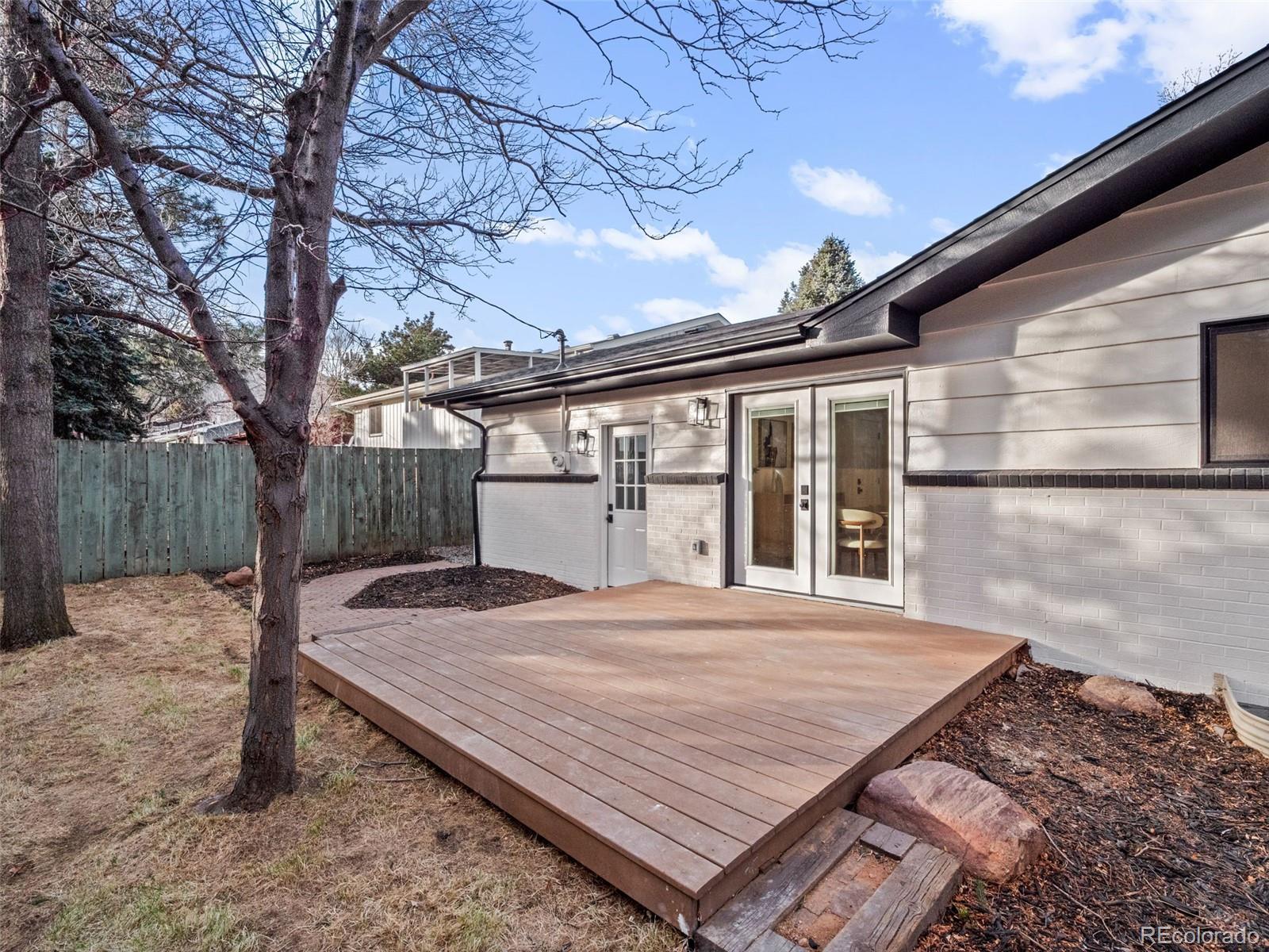 3490 Emerson Avenue Boulder, CO 80305 - Photo 27 of 31 a view of backyard with a deck and wooden floor
