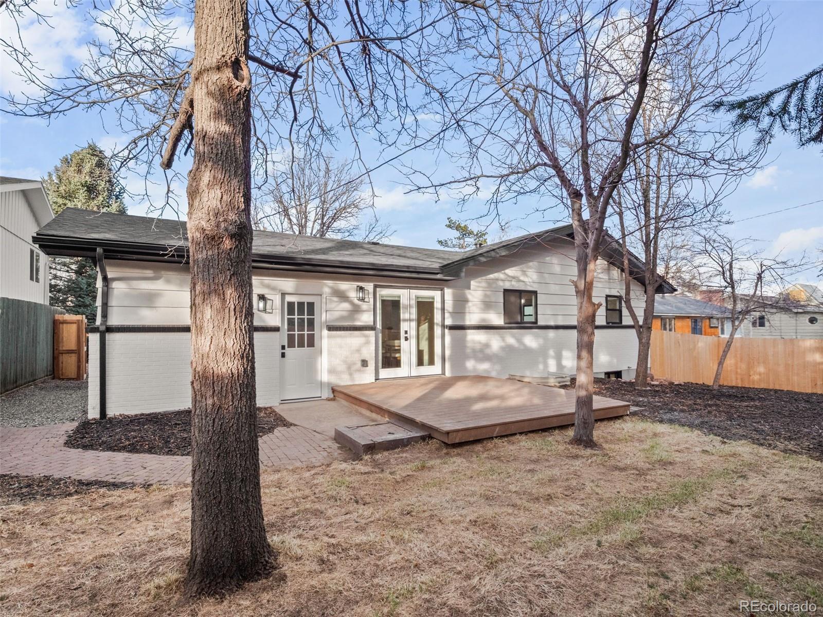 3490 Emerson Avenue Boulder, CO 80305 - Photo 29 of 31 a front view of a house with garden