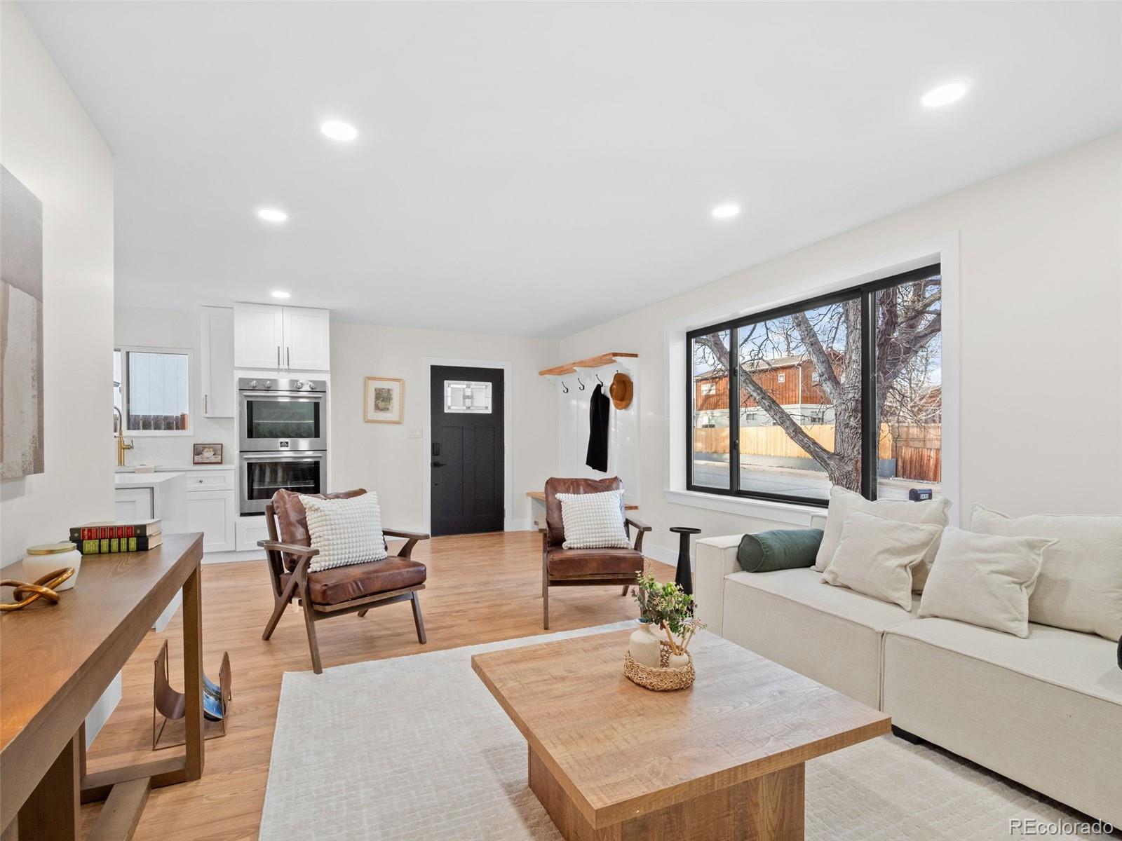 3490 Emerson Avenue Boulder, CO 80305 - Photo 5 of 31 a living room with furniture and a large window