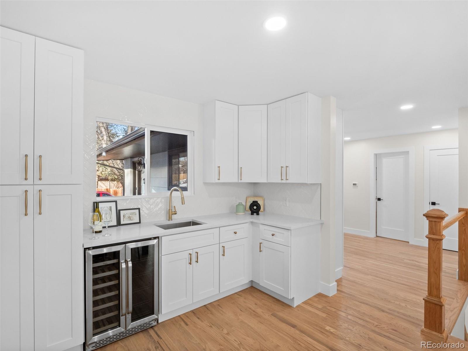 3490 Emerson Avenue Boulder, CO 80305 - Photo 6 of 31 a kitchen with a sink cabinets and wooden floor