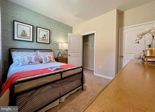 a bedroom with double bed and a couch