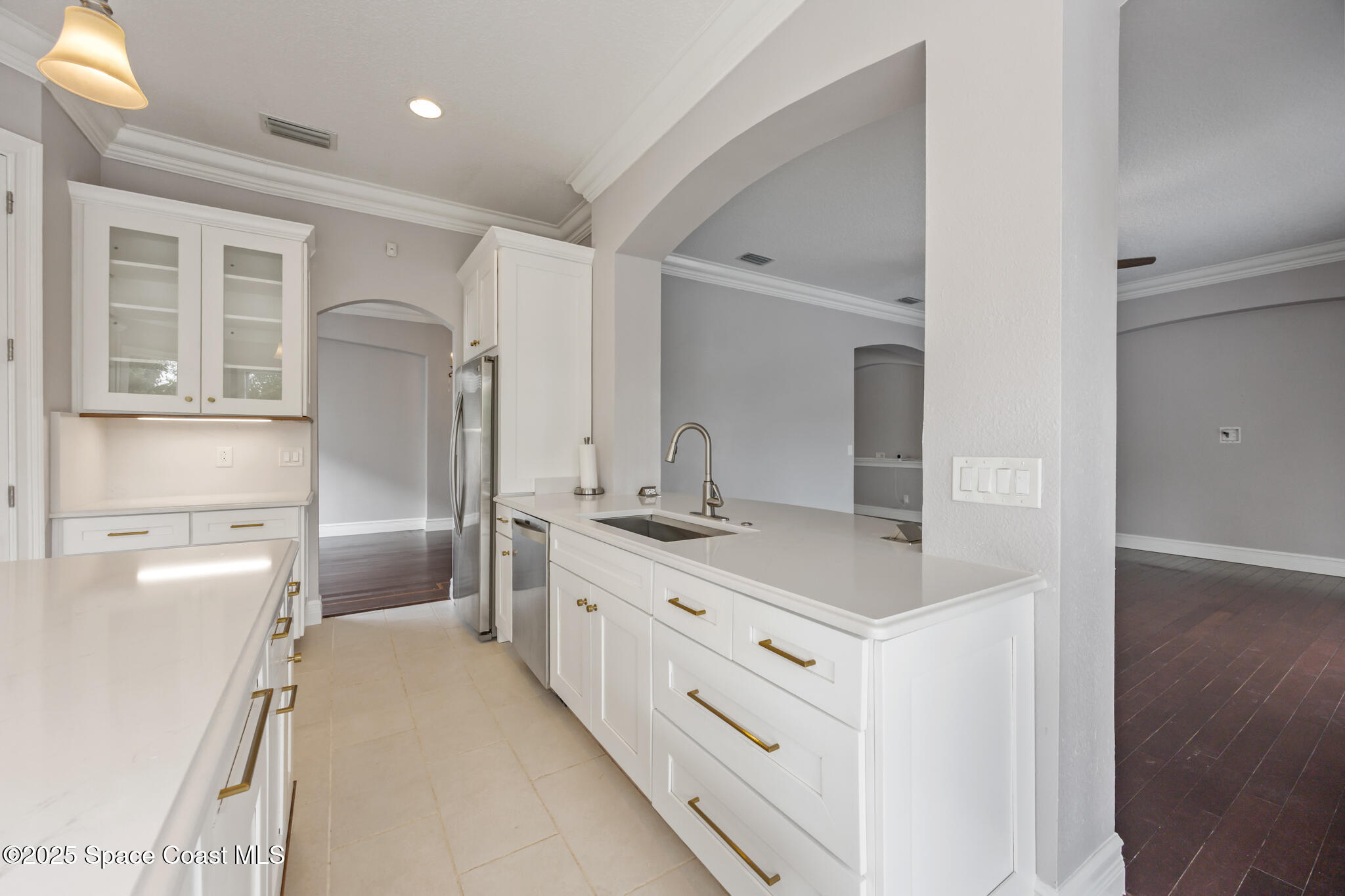 3326 Peninsula Circle Melbourne, FL 32940 - Photo 13 of 53 a bathroom with a double vanity sink a mirror and a shower