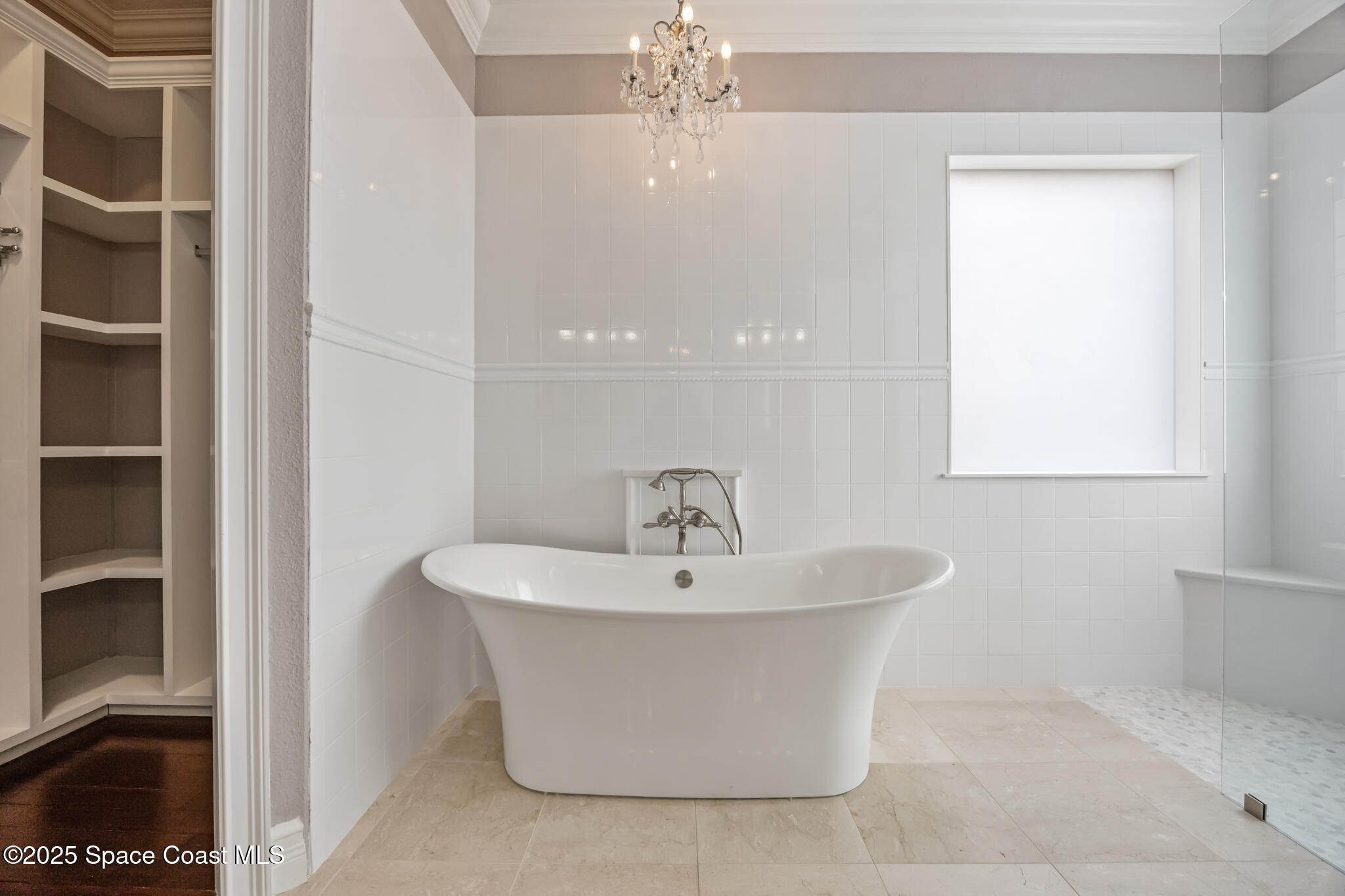 3326 Peninsula Circle Melbourne, FL 32940 - Photo 21 of 53 a white bath tub sitting in a bathroom