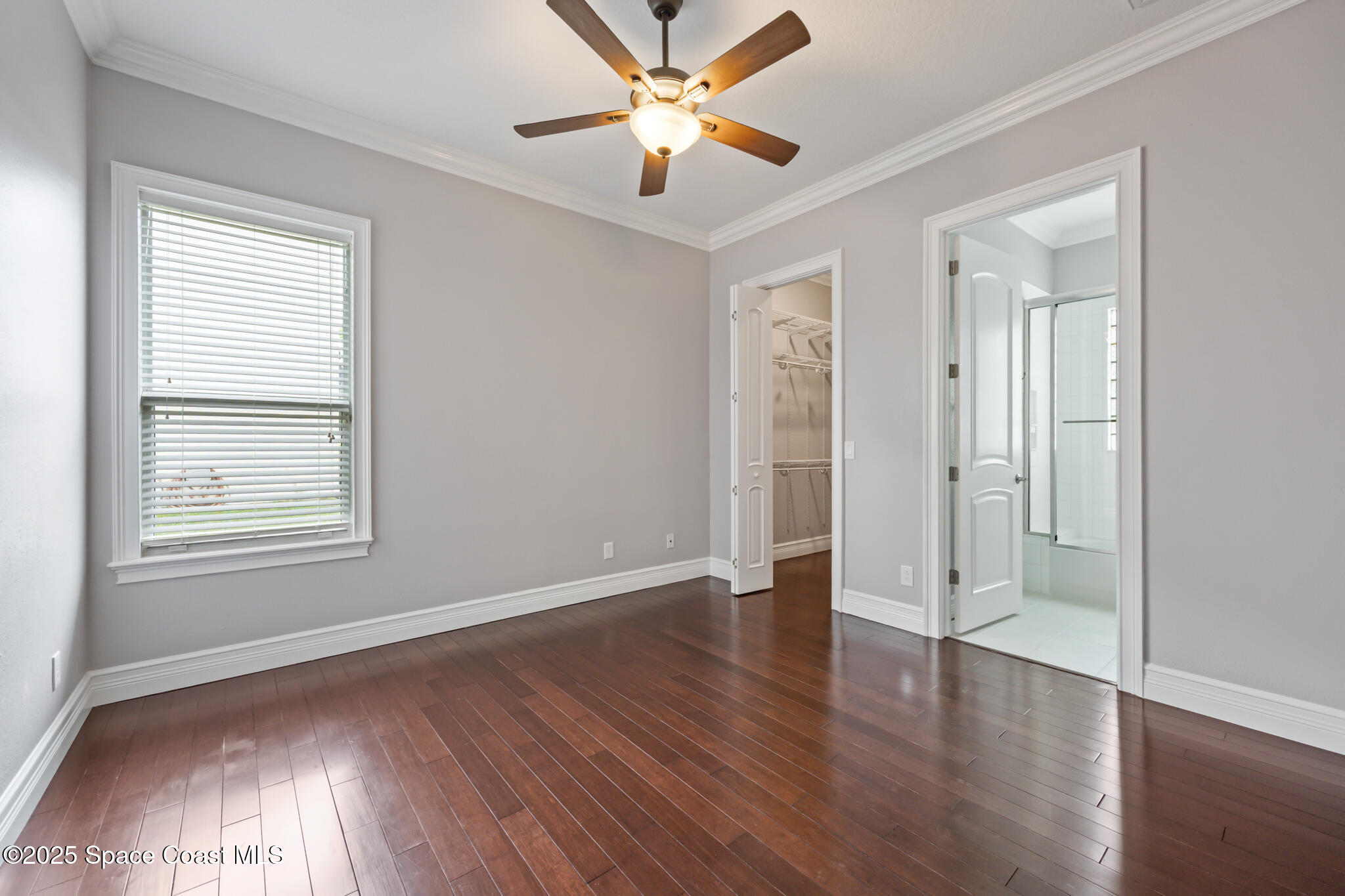 3326 Peninsula Circle Melbourne, FL 32940 - Photo 22 of 53 wooden floor in an empty room with a window