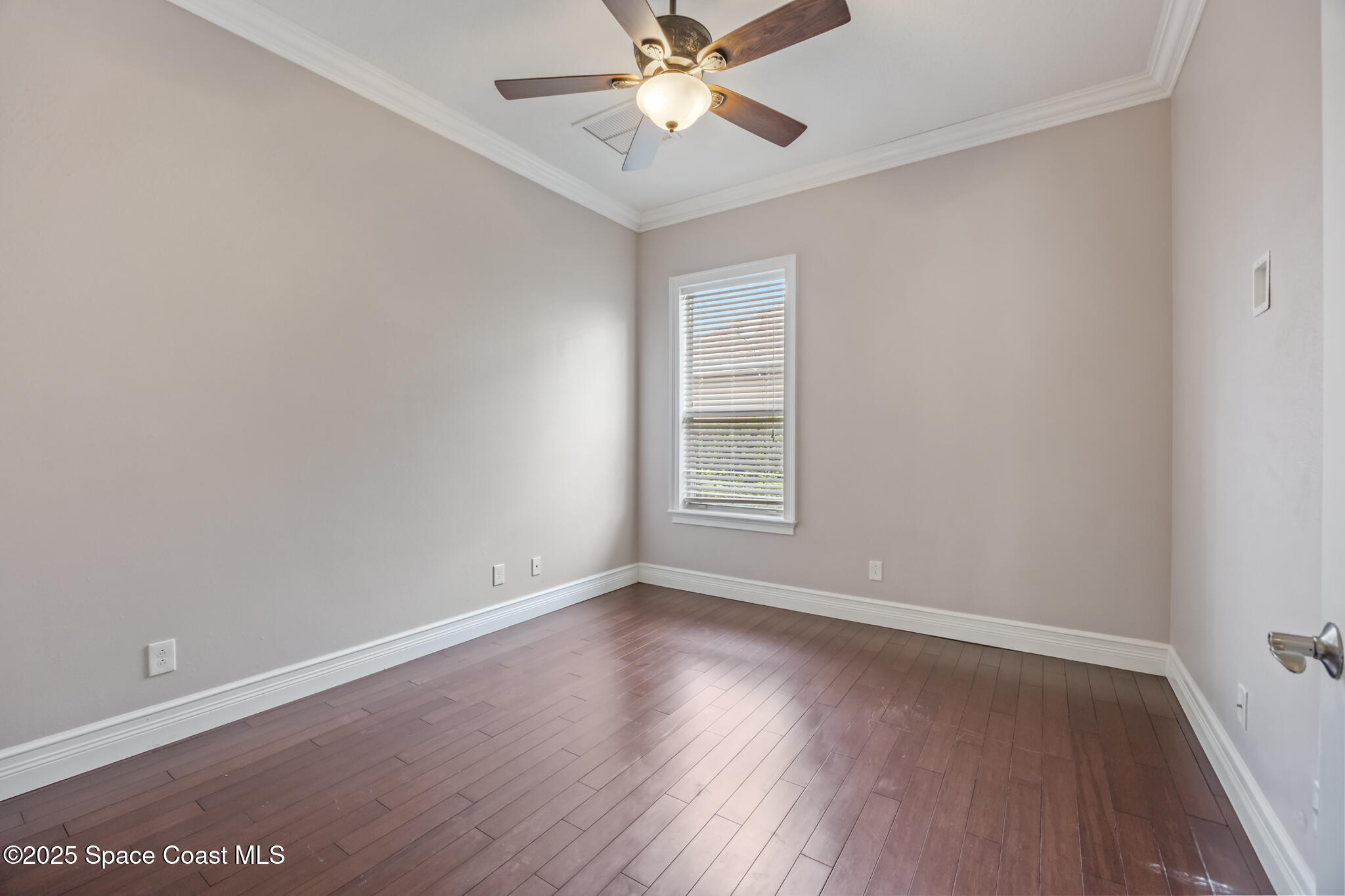 3326 Peninsula Circle Melbourne, FL 32940 - Photo 28 of 53 an empty room with wooden floor closet and windows