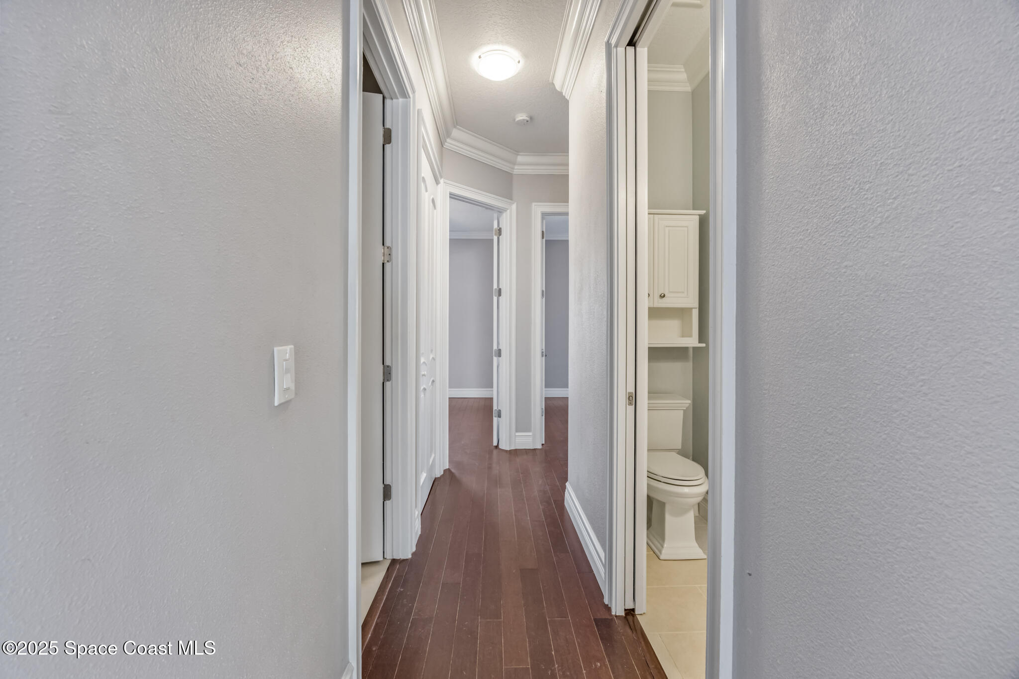 3326 Peninsula Circle Melbourne, FL 32940 - Photo 31 of 53 a view of a hallway with wooden floor