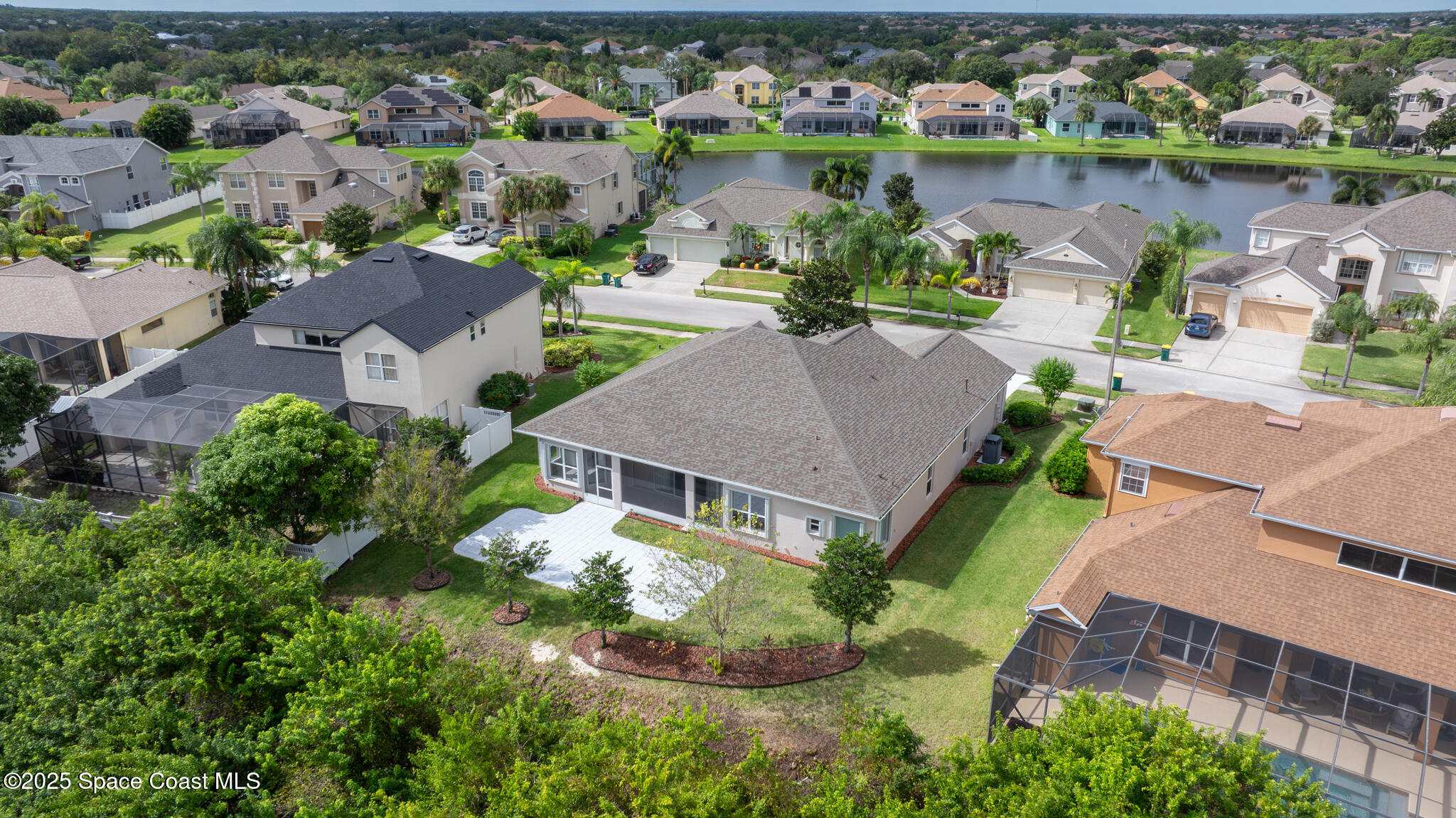 3326 Peninsula Circle Melbourne, FL 32940 - Photo 44 of 53 an aerial view of a house with a lake view