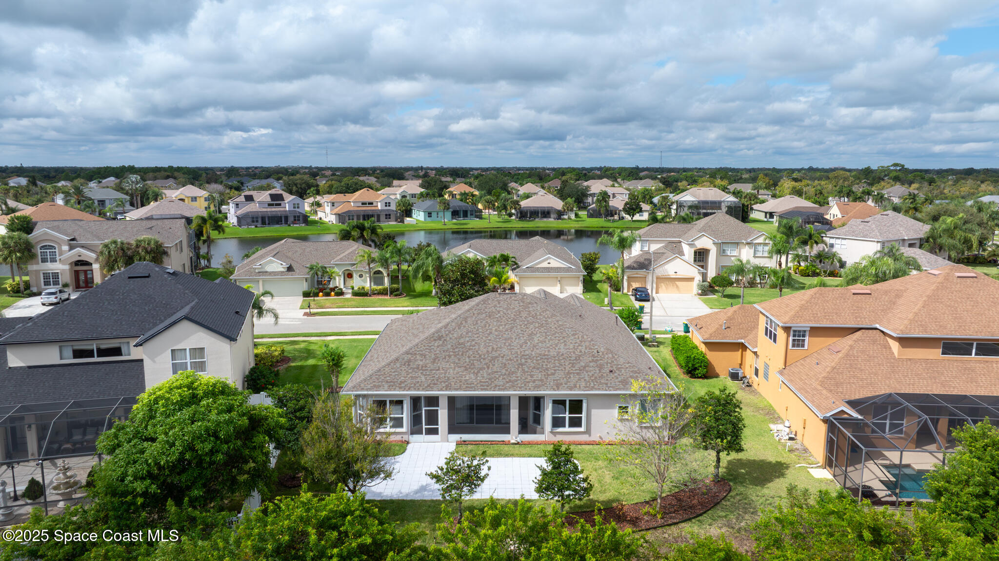 3326 Peninsula Circle Melbourne, FL 32940 - Photo 46 of 53 aerial view of a house with a garden