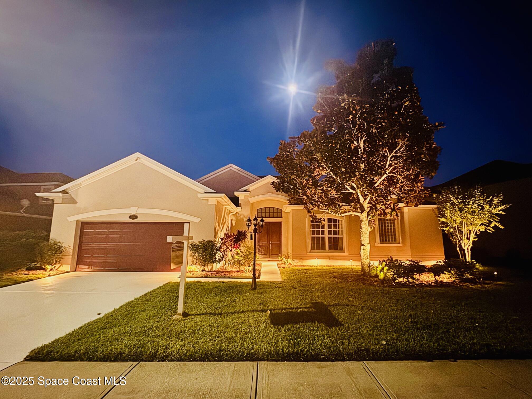3326 Peninsula Circle Melbourne, FL 32940 - Photo 47 of 53 a front view of a house with garden