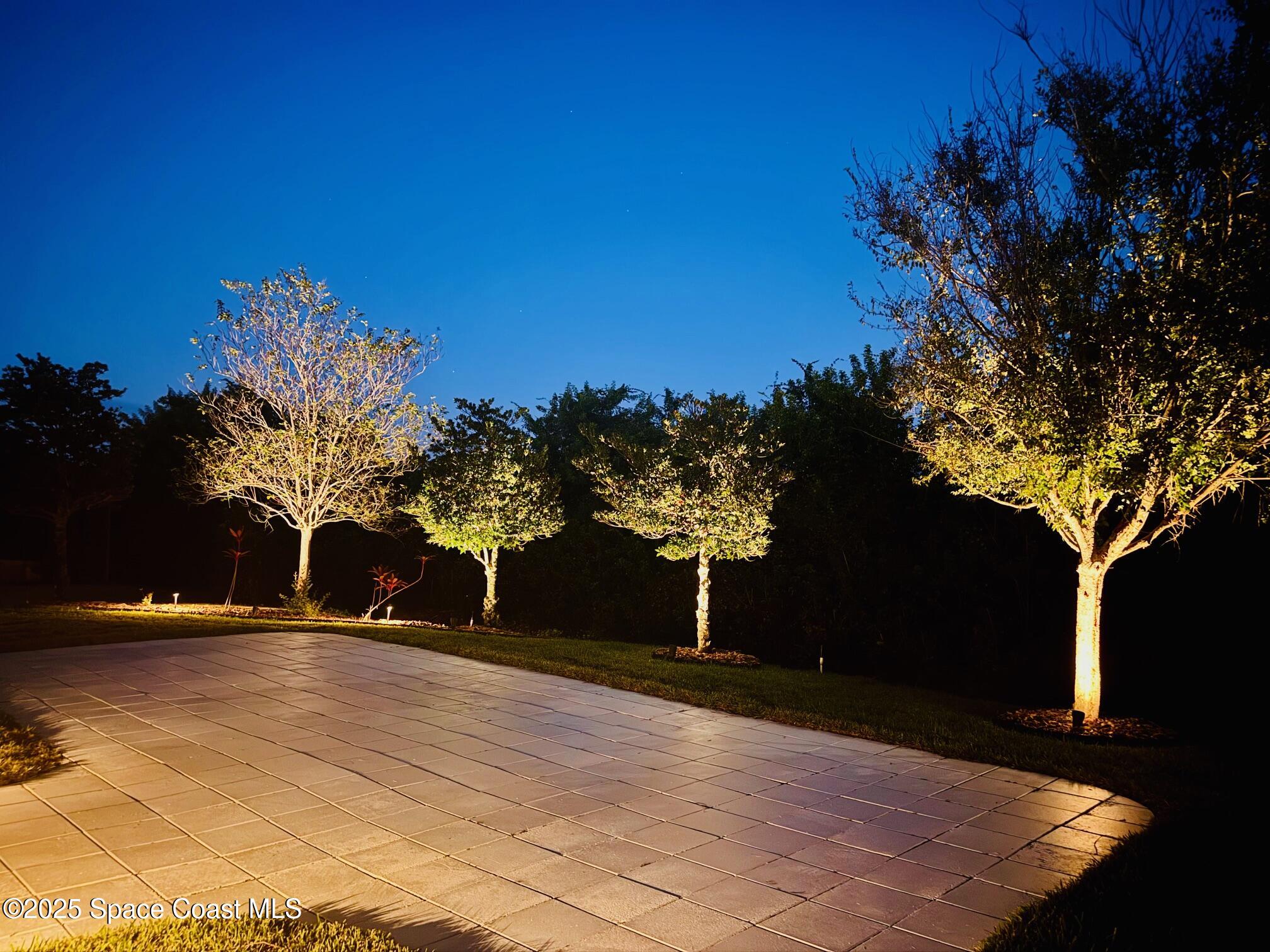 3326 Peninsula Circle Melbourne, FL 32940 - Photo 50 of 53 a view of a house with a yard and tree s