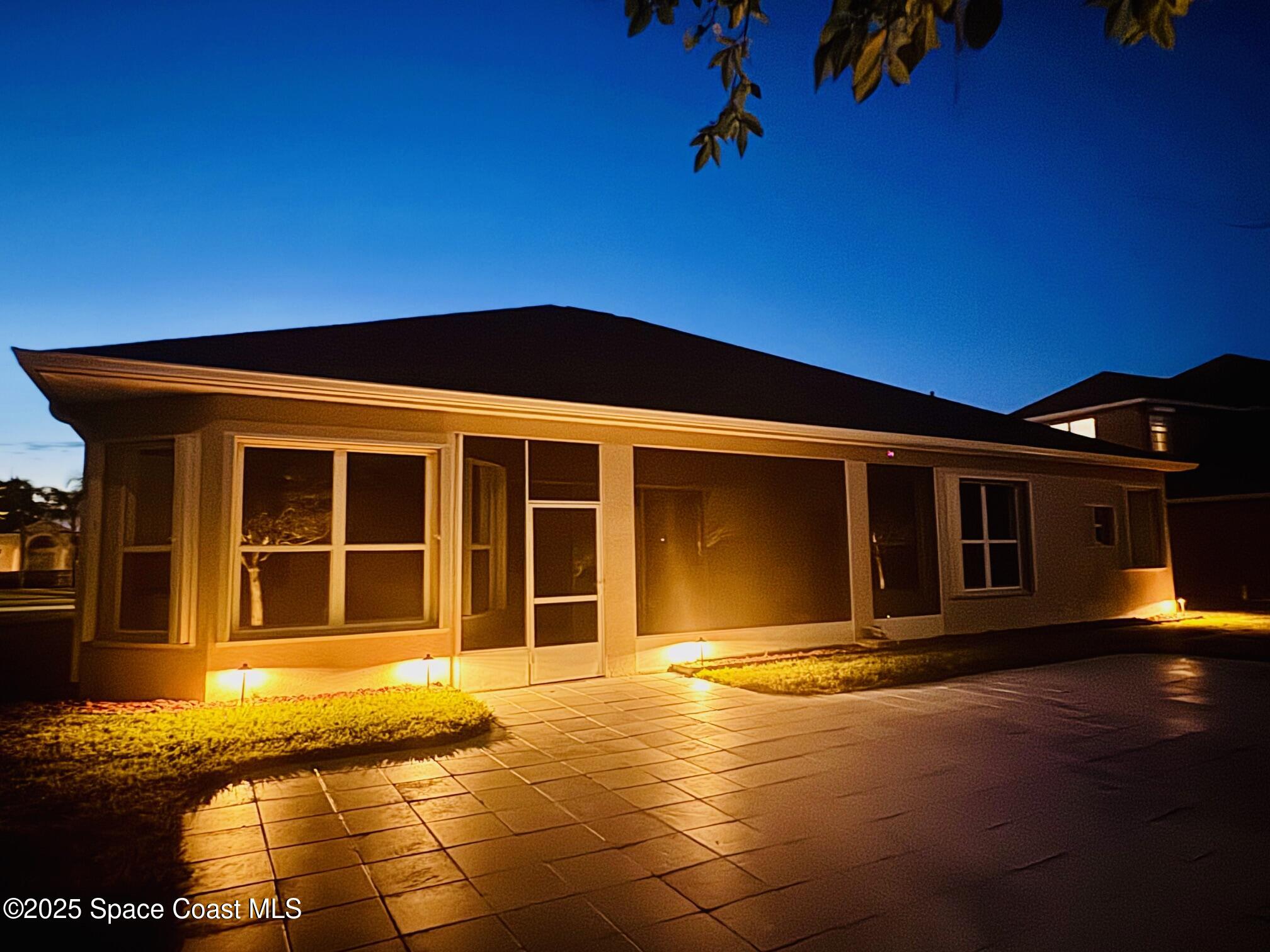 3326 Peninsula Circle Melbourne, FL 32940 - Photo 51 of 53 a view of a house with a swimming pool