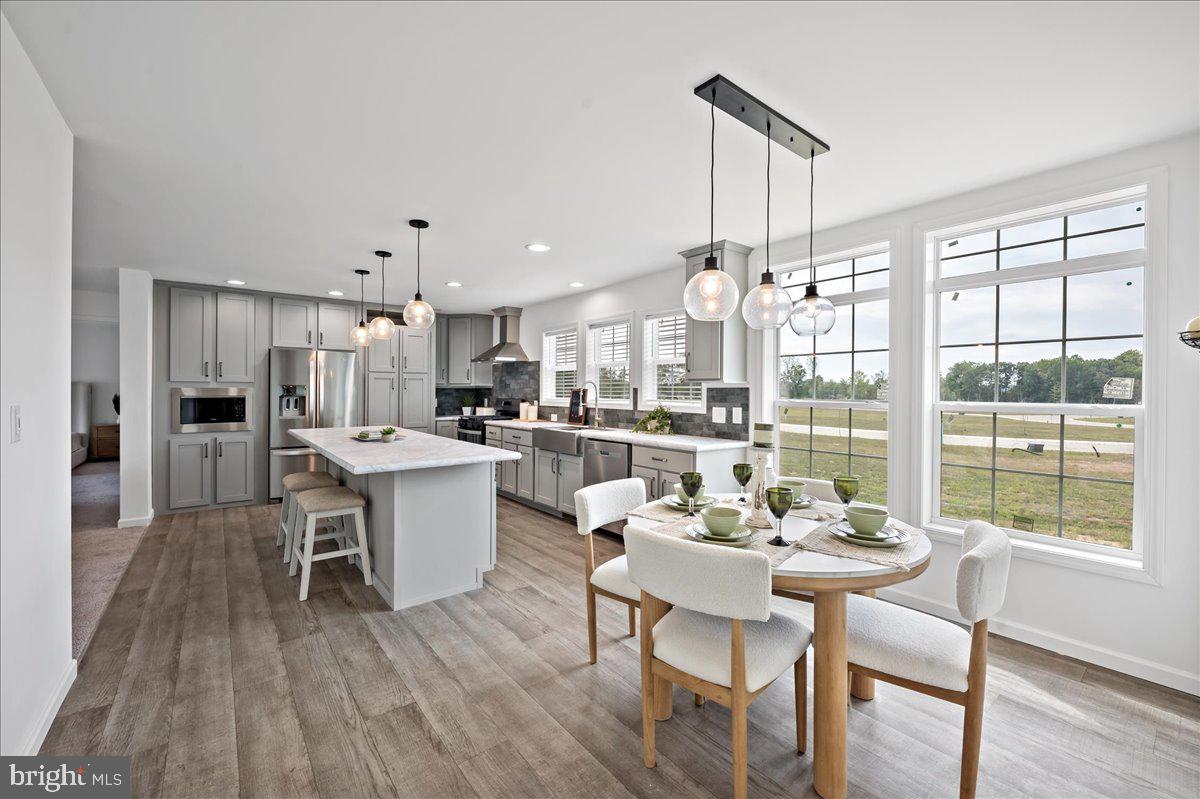3983 Hastings Road Walnutport, PA 18088 - Photo 15 of 51 a view of a dining room with furniture window and wooden floor