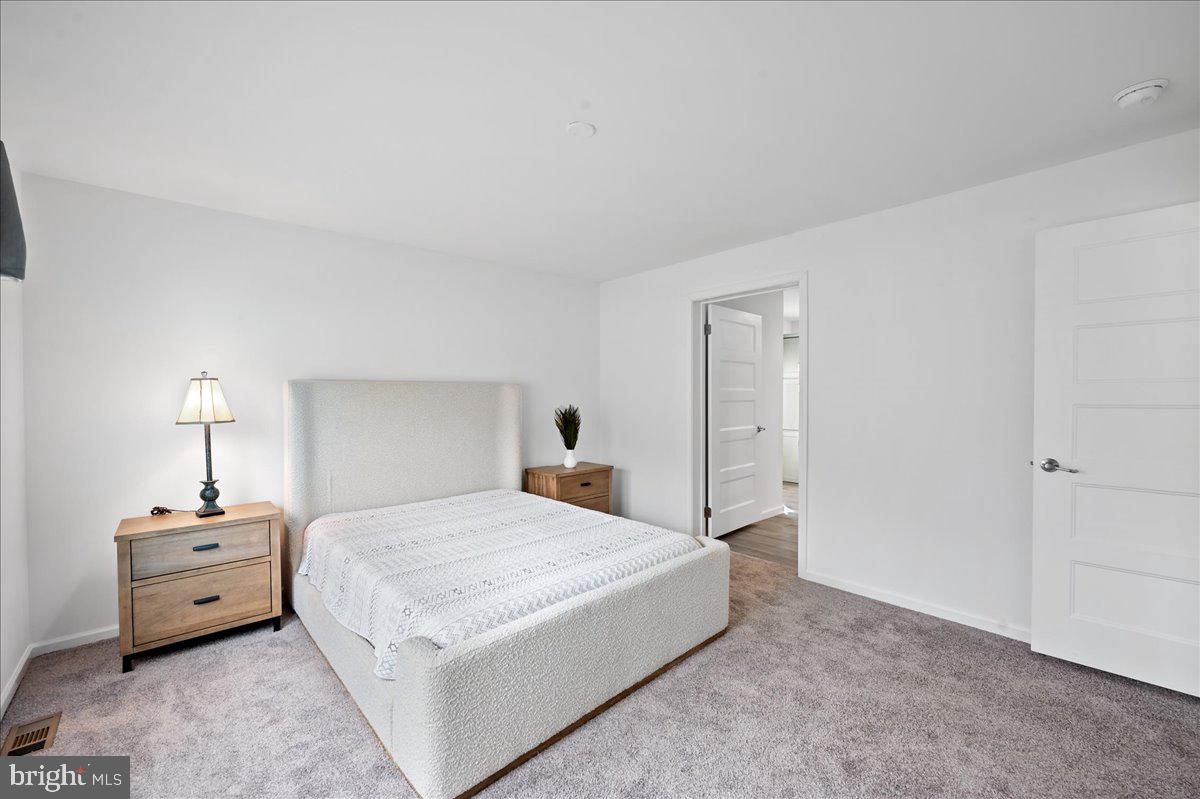 3983 Hastings Road Walnutport, PA 18088 - Photo 26 of 51 a bedroom with a bed and a lamp