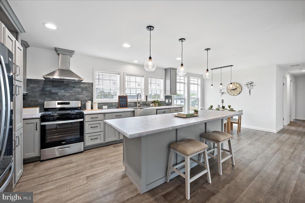 3983 Hastings Road Walnutport, PA 18088 - Photo 10 of 51 a kitchen with stainless steel appliances kitchen island granite countertop a stove a sink and a refrigerator