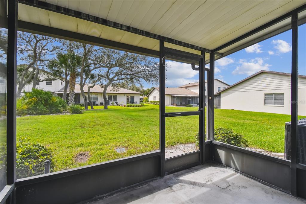 2480 Enterprise Road, Unit 6 Clearwater, FL 33763 - Photo 22 of 43 a view of an outdoor space and a back yard