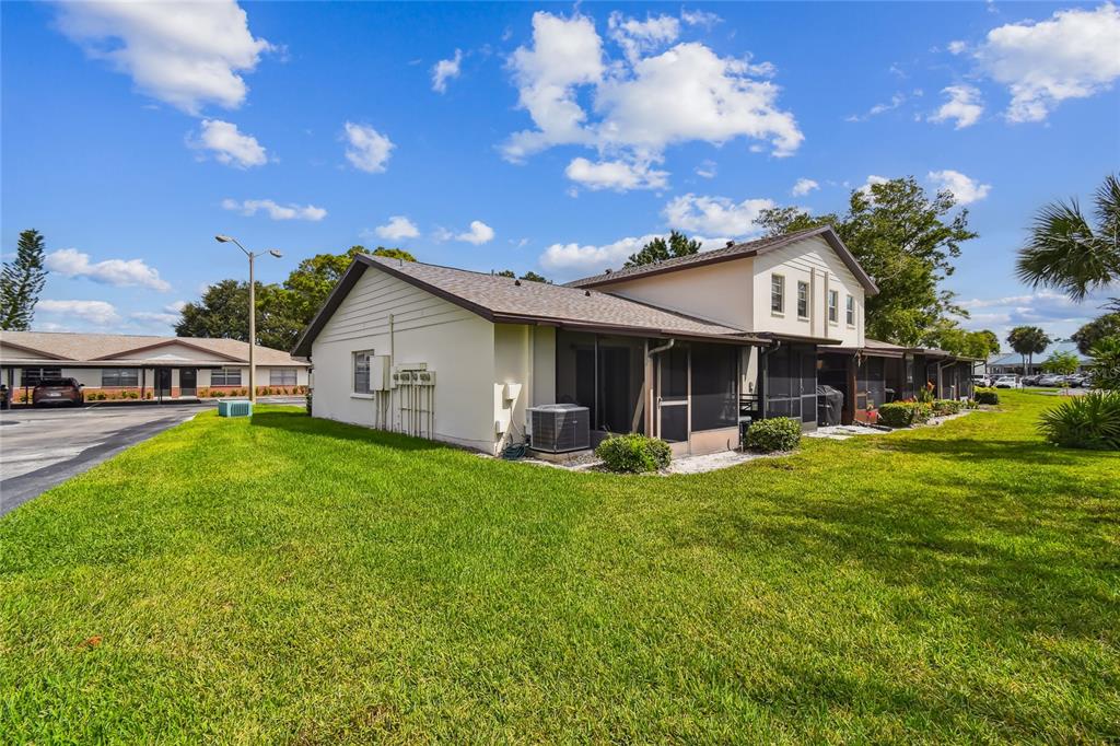 2480 Enterprise Road, Unit 6 Clearwater, FL 33763 - Photo 23 of 43 a view of a house with backyard porch and sitting area