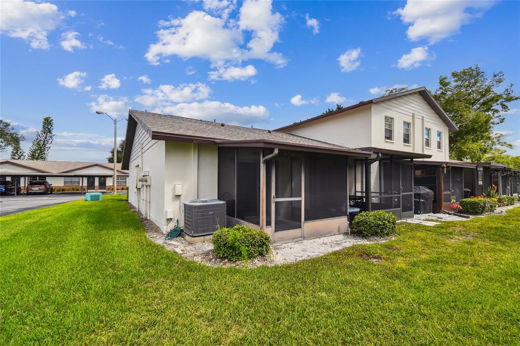 2480 Enterprise Road, Unit 6 Clearwater, FL 33763 - Photo 24 of 43 a view of a house with back yard and sitting area