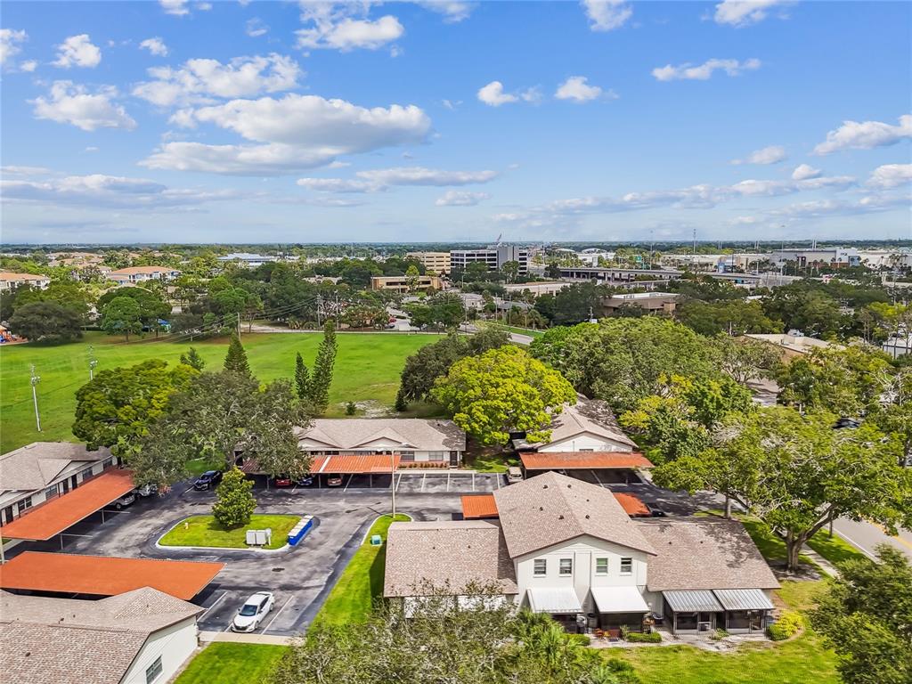 2480 Enterprise Road, Unit 6 Clearwater, FL 33763 - Photo 31 of 43 an aerial view of a house with yard swimming pool and outdoor seating