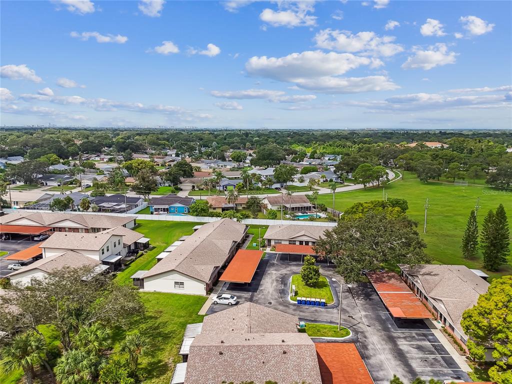 2480 Enterprise Road, Unit 6 Clearwater, FL 33763 - Photo 32 of 43 an aerial view of a garden with swimming pool