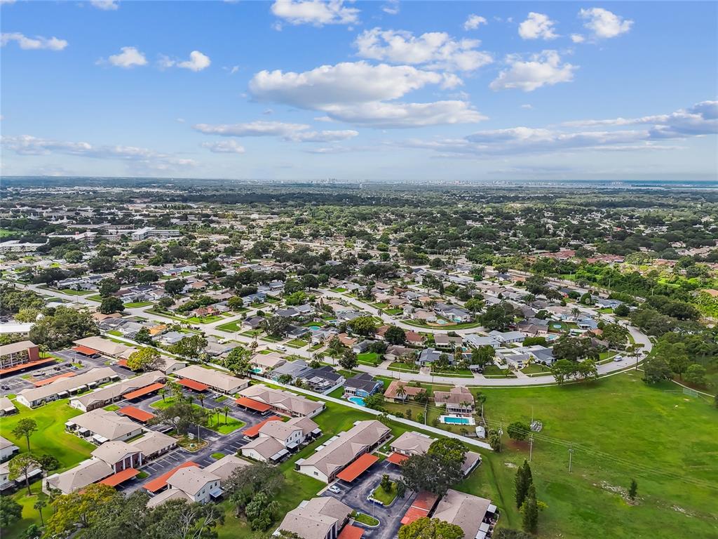 2480 Enterprise Road, Unit 6 Clearwater, FL 33763 - Photo 34 of 43 an aerial view of residential houses with outdoor space and trees