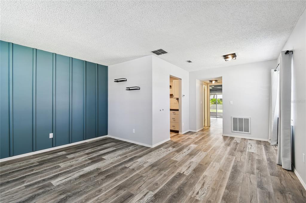2480 Enterprise Road, Unit 6 Clearwater, FL 33763 - Photo 5 of 43 a view of a room with wooden floor and bathroom